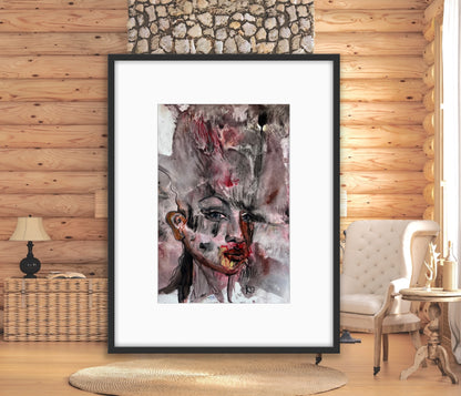 Framed abstract art print on a wooden wall with a cozy interior setting.