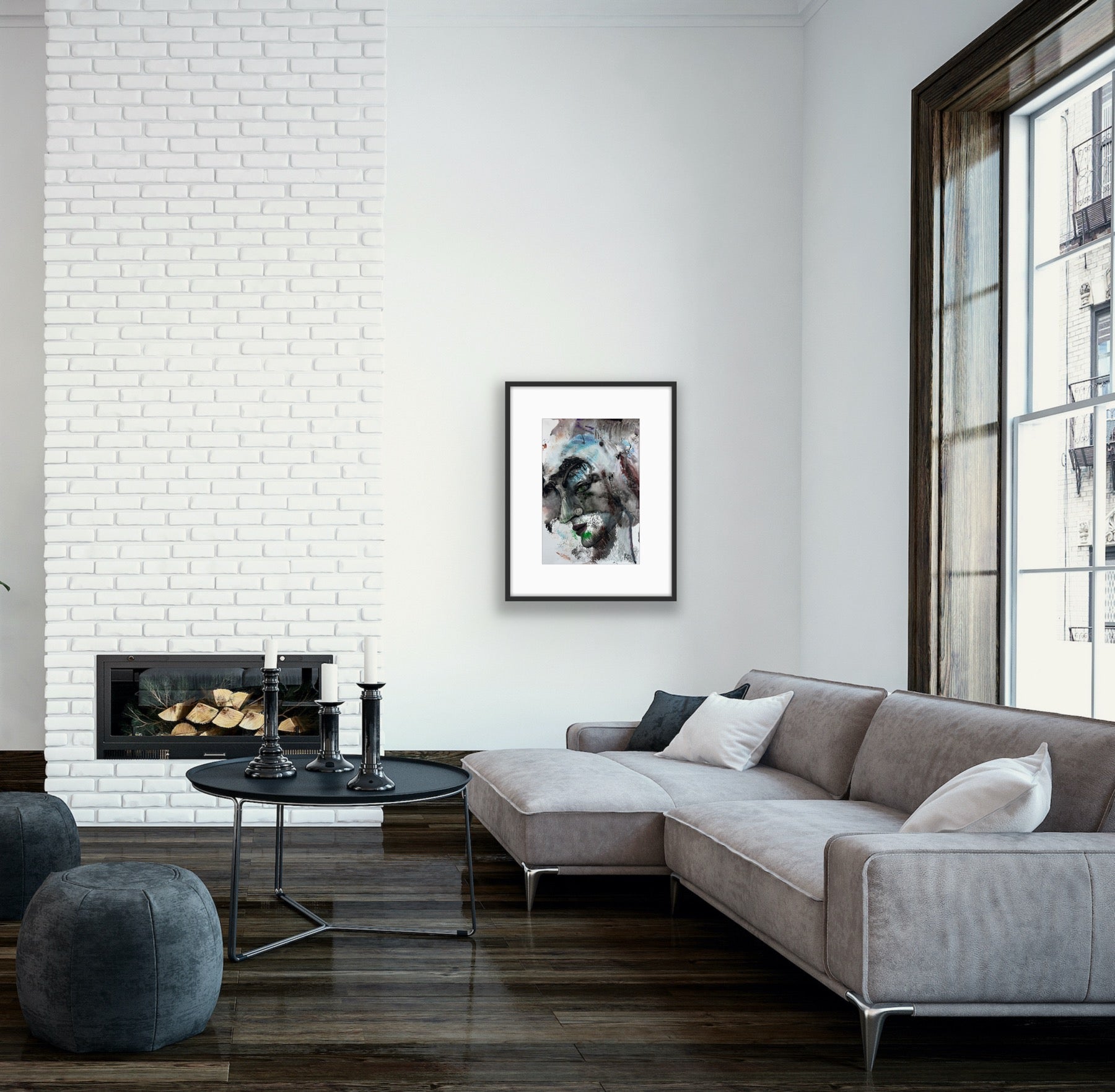 Modern living room with gray sectional sofa, white brick wall, and large window.