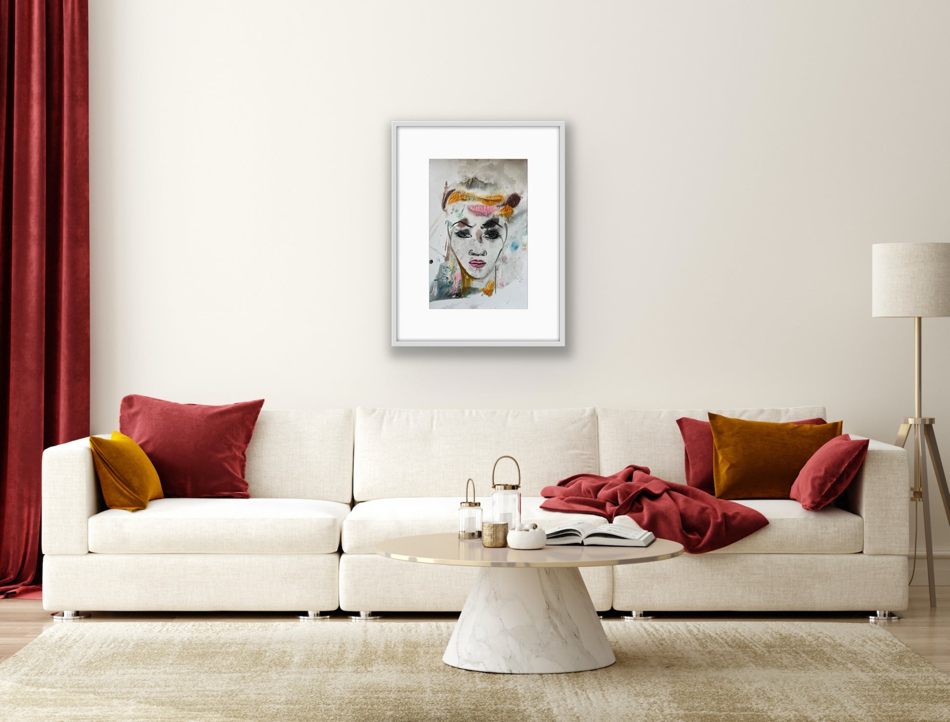 Modern living room with a white sofa, colorful cushions, and a framed artwork on the wall.