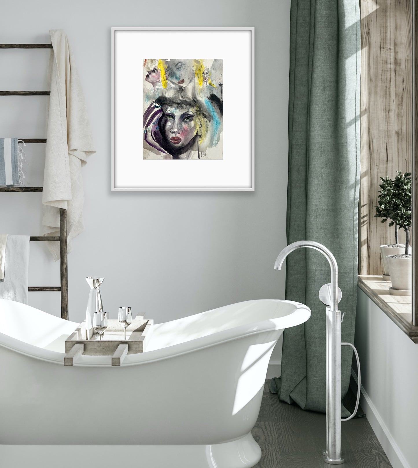 White-framed watercolor portrait hanging in a modern bathroom with a freestanding tub and sage green curtain.