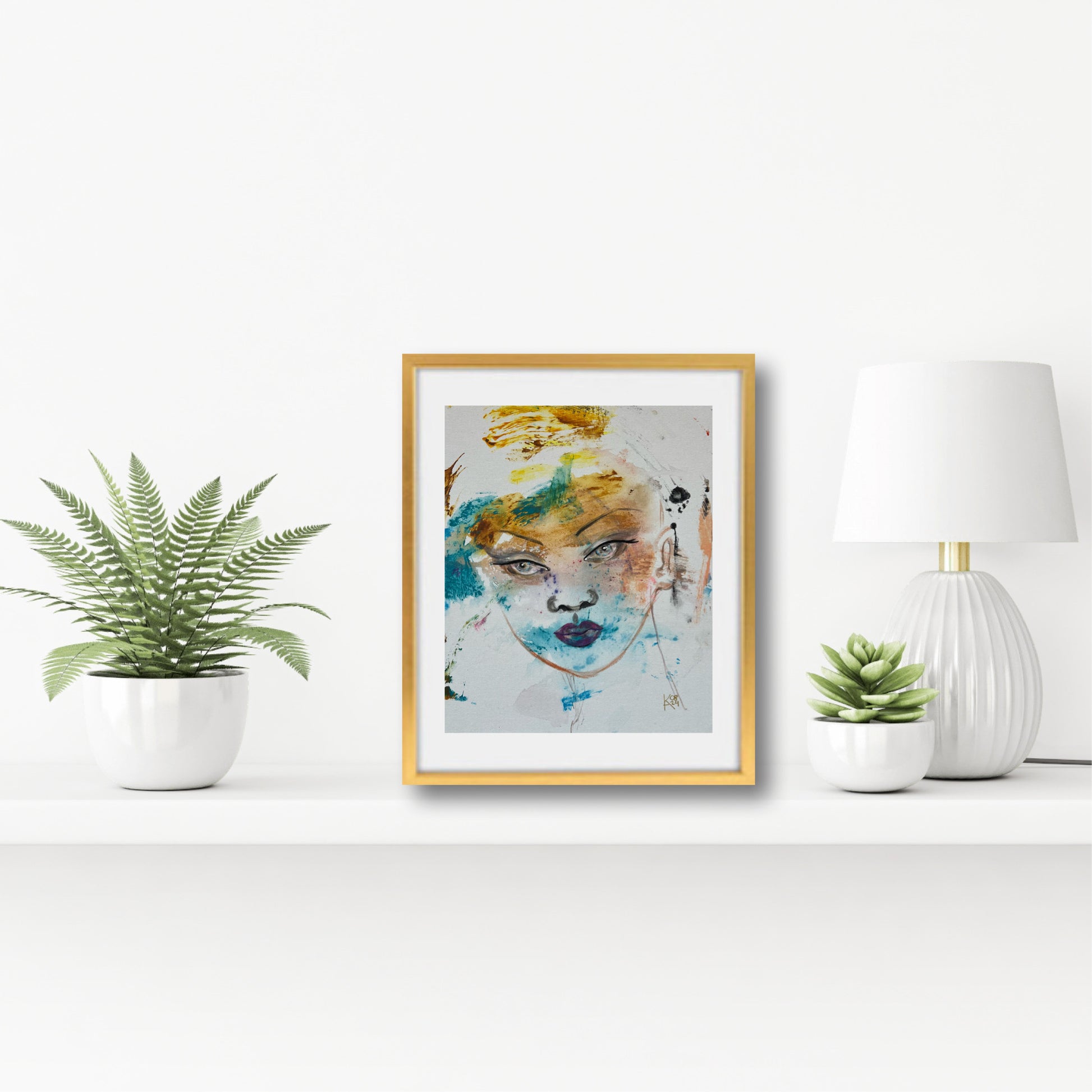 Original acrylic painting Silence in gold frame on a white shelf with plants and lamp, surrealist female portrait wall art