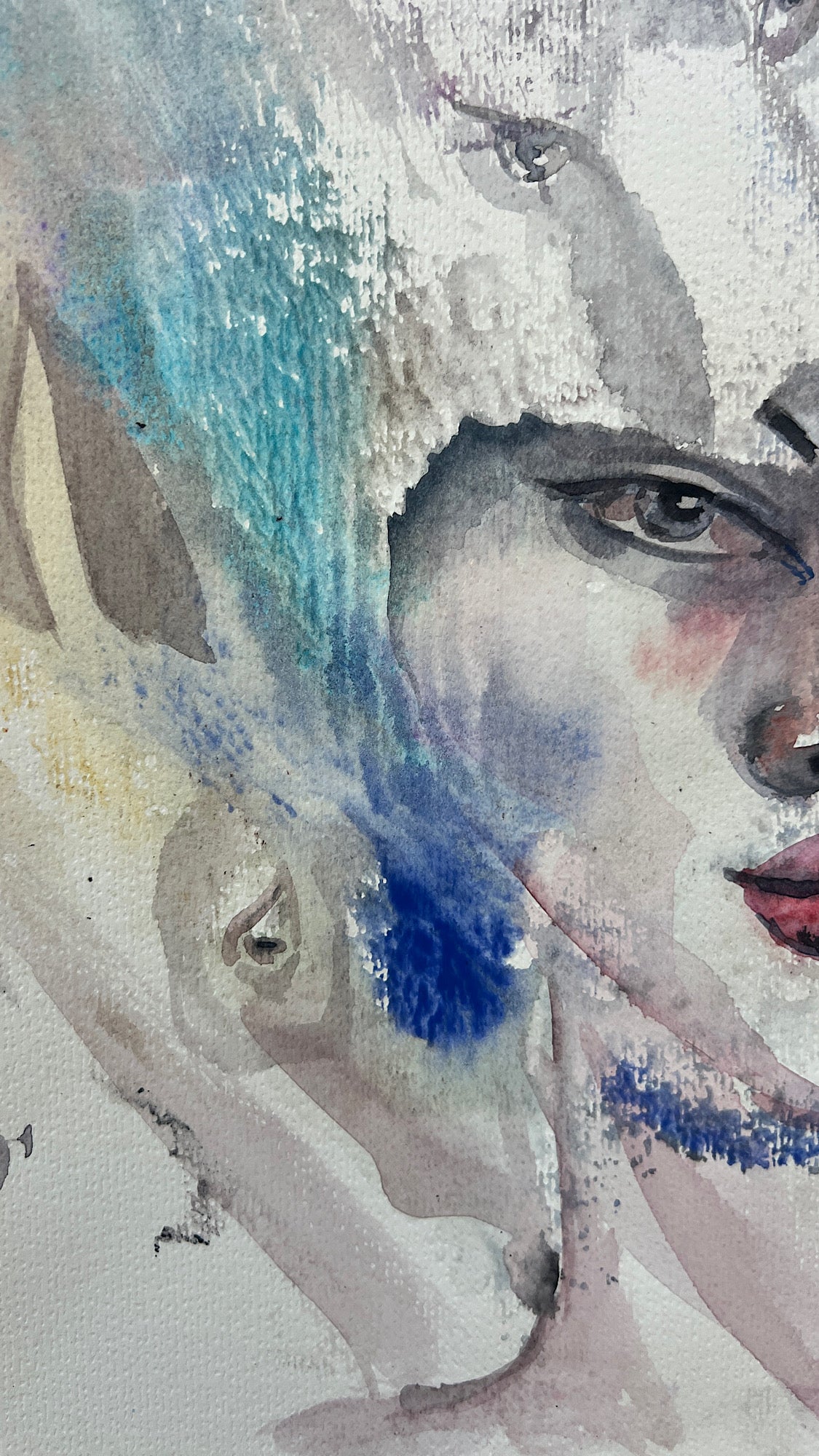 Close-up detail of White Reverie watercolor painting showing teal and cobalt blue brushstrokes near the face