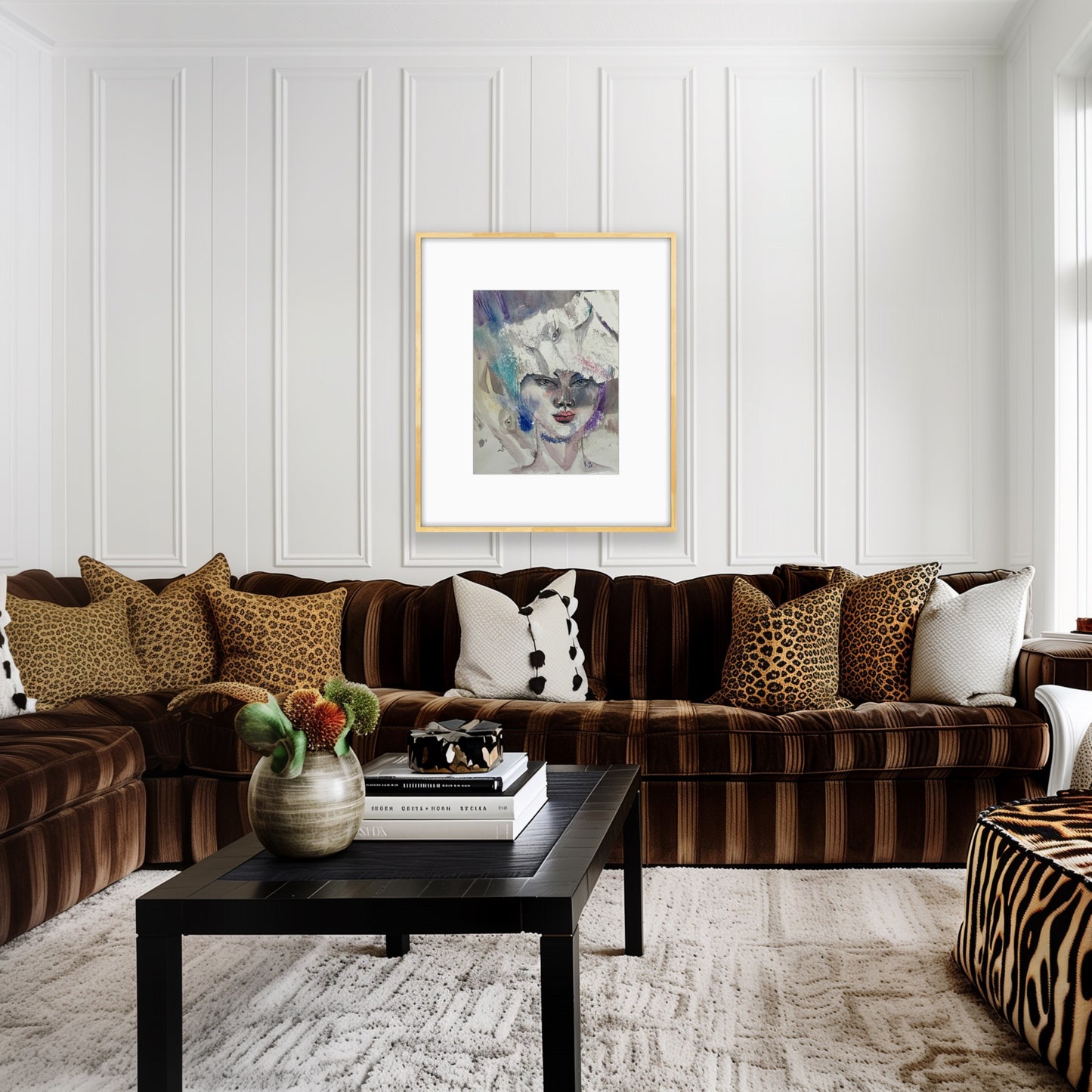 Reverie original watercolor portrait painting in a gold frame displayed in a living room with brown velvet sofas and smile table